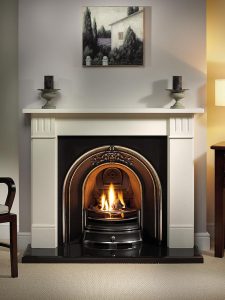 Clarendon 56" Agean limestone mantel with Landsdowne highlight arched insert, decorative gas fire with ceramic coals and 54" bevelled granite hearth